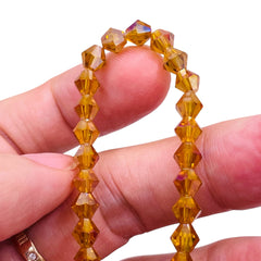 6mm Thunder Polish Glass Crystal Bicone Topaz AB
