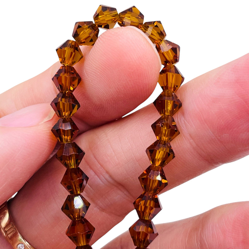 6mm Thunder Polish Glass Crystal Bicone Med. Smoked Topaz