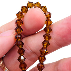 6mm Thunder Polish Glass Crystal Bicone Med. Smoked Topaz