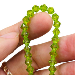 6mm Thunder Polish Glass Crystal Bicone Lt. Olivine