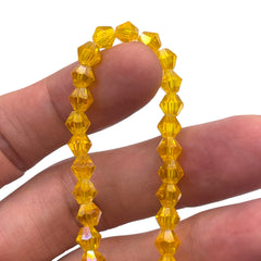 6mm Thunder Polish Glass Crystal Bicone Yellow Gold AB